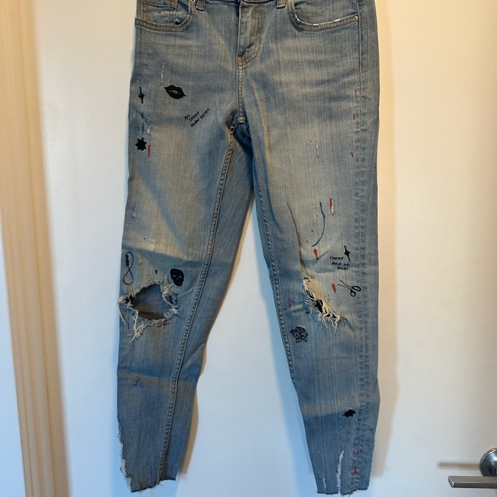 Distressed Denim Jeans with Graphic Accents